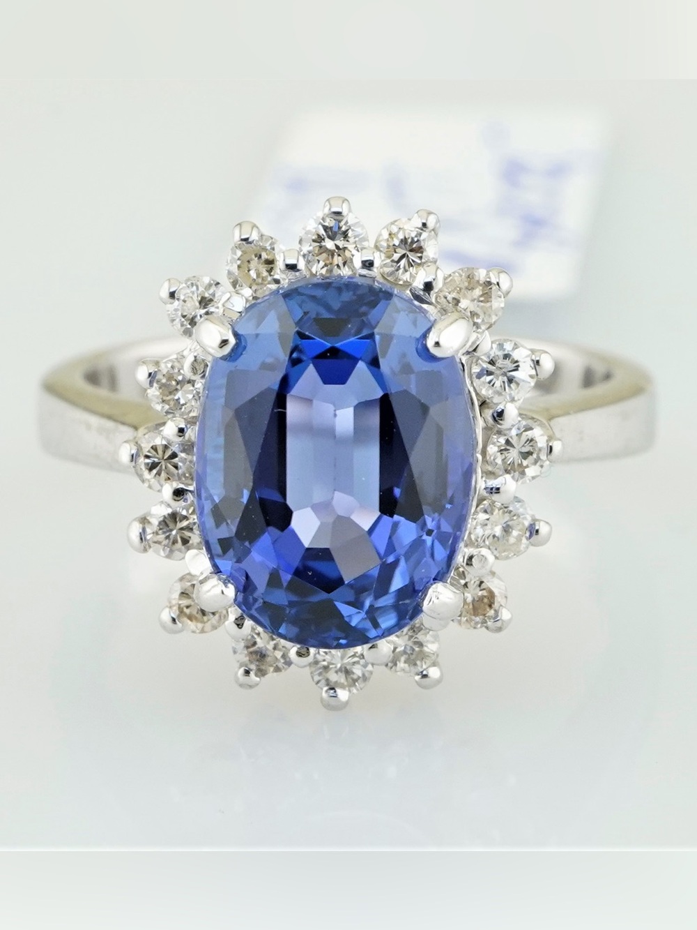 Solid 14k white gold natural tanzanite and diamond halo style ring